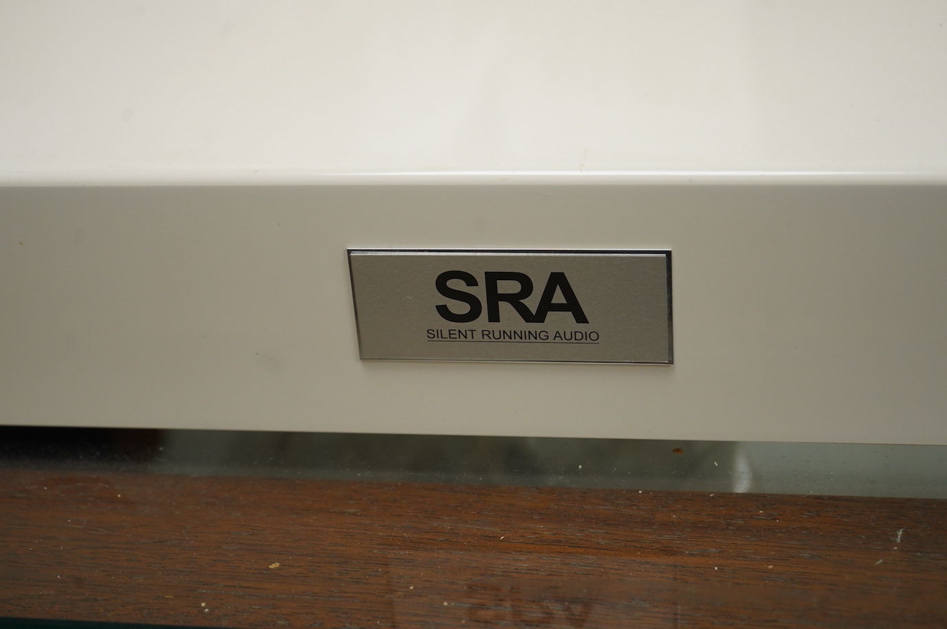 A three section Soundbox HiFi stereo stand in teak, 83cm high, 66cm wide, 46.5cm deep, together with three Silent Running Audio (SRA) Ohio Class high end audio base units in cream cases (designed to reduce vibration) - o